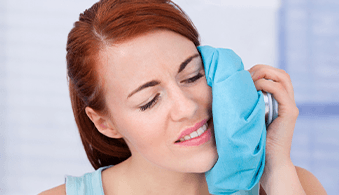 Woman using a cold compress