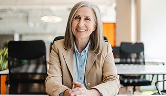 Woman in blazer smiling