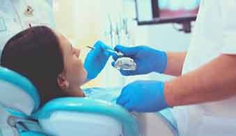 Lady receives dental treatment