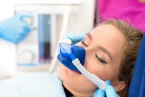 Close up of woman receiving mask for nitrous oxide sedation